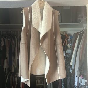 Brown suede vest with soft detail inside.